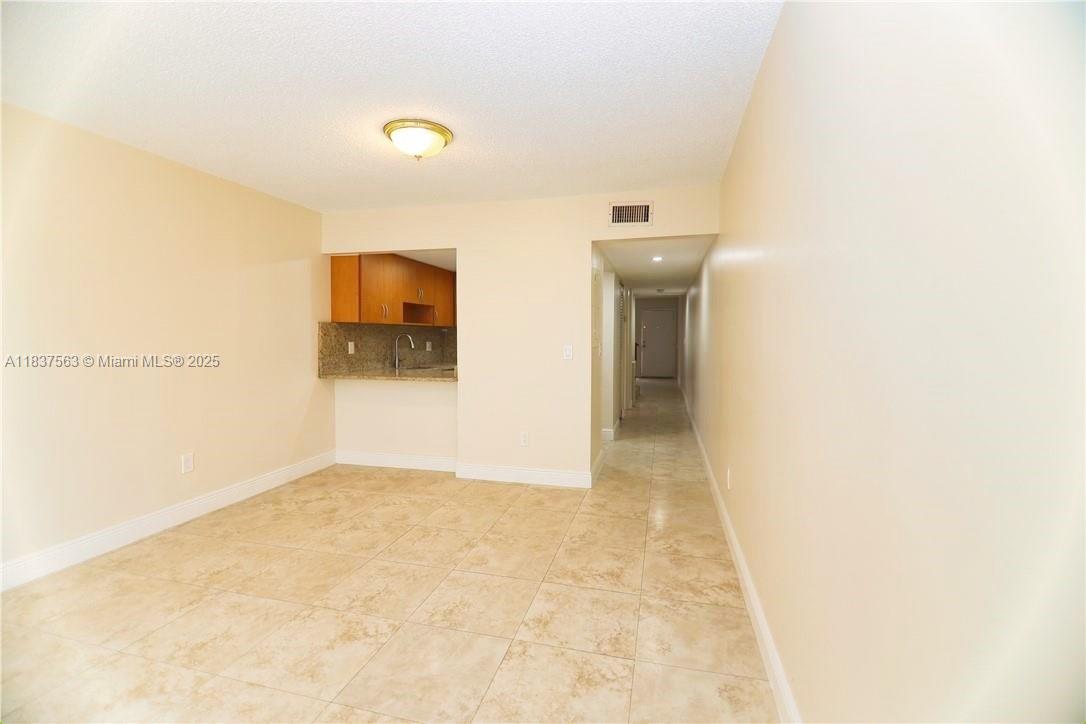 1654 Northeast 151st Street Miami, FL 33162 - Photo 9 of 19 a view of a hallway