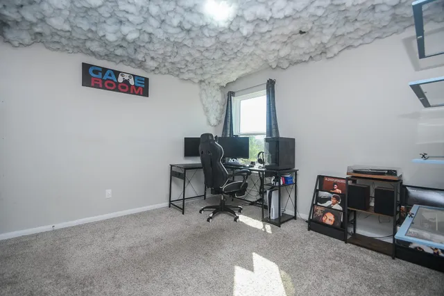 a view of a workspace with furniture