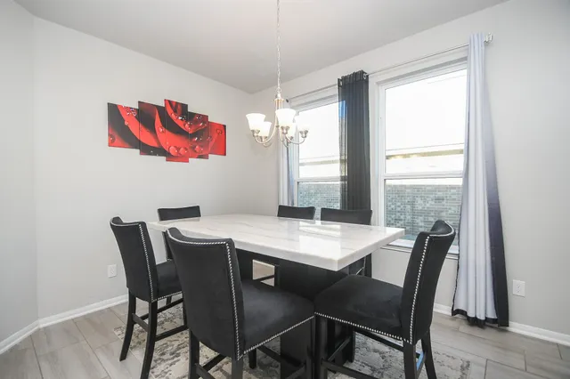 a view of a dining room with furniture window and outside view