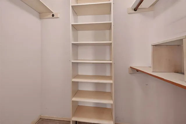 a kitchen with kitchen island a sink appliances and cabinets