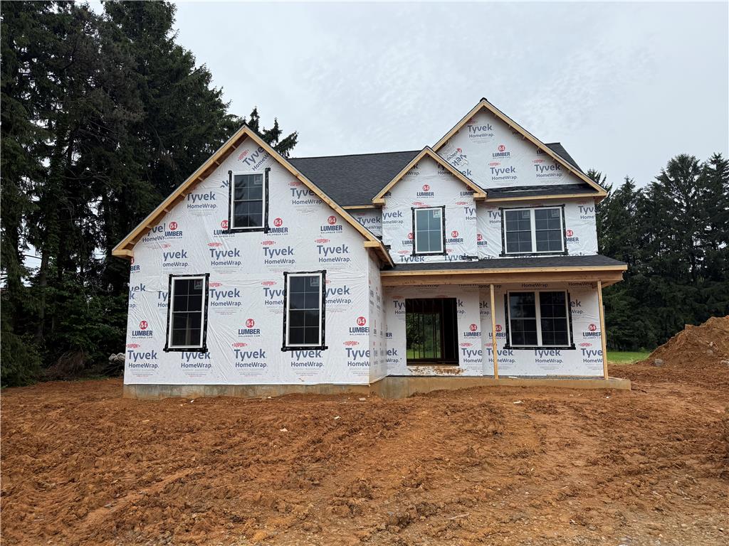 1551 Kelchner Road Bethlehem, PA 18018 - Photo 1 of 4 Under construction home with Tyvek HomeWrap cladding and black-framed windows, ready for exterior finishes.