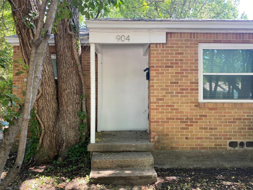 904 Denton Street Denton, TX 76201 - Photo 1 of 9 a brick house with a outdoor space