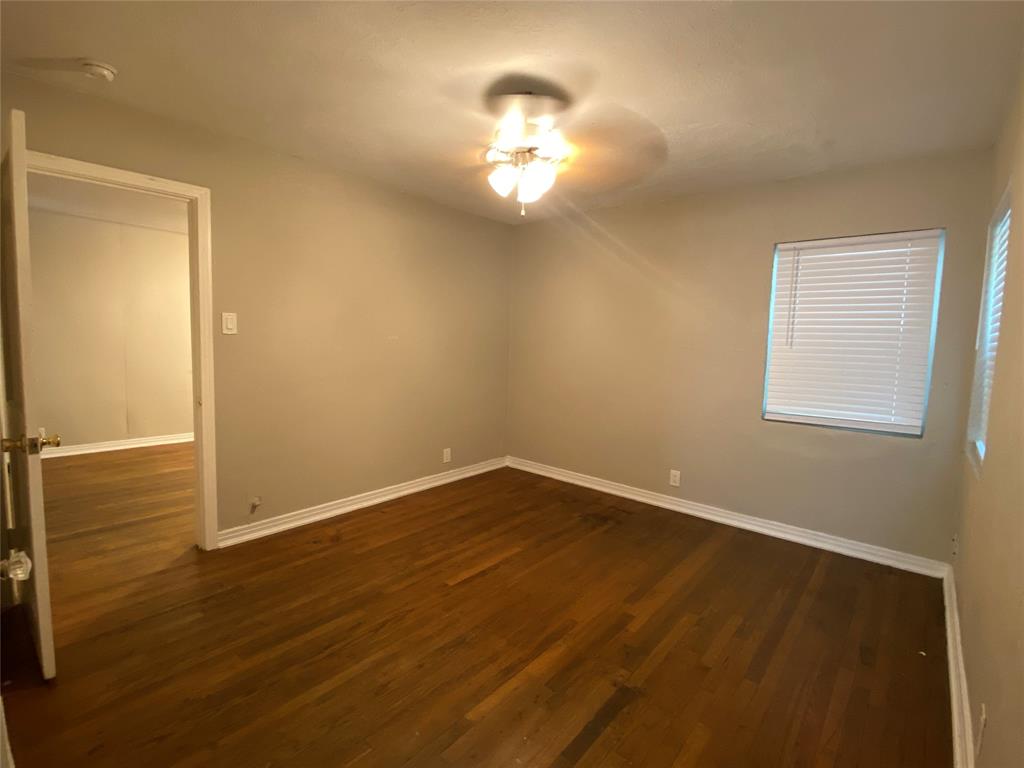 904 Denton Street Denton, TX 76201 - Photo 8 of 9 a view of a livingroom with a chandelier