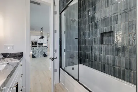 a bathroom with a granite countertop sink mirror and double