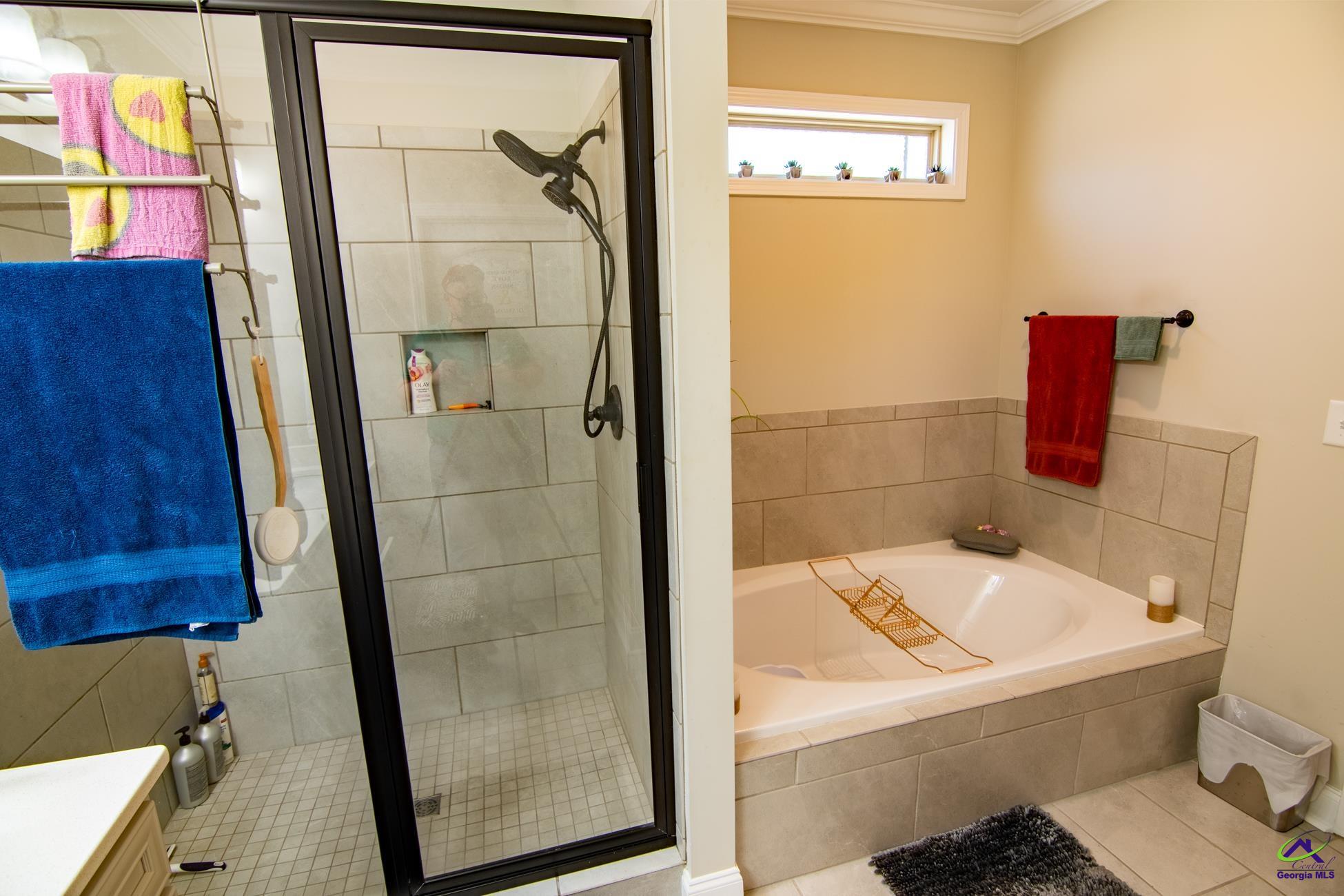 123 Logan's Mill Trail Warner Robins, GA 31093 - Photo 13 of 23 a bathroom with a bathtub and shower