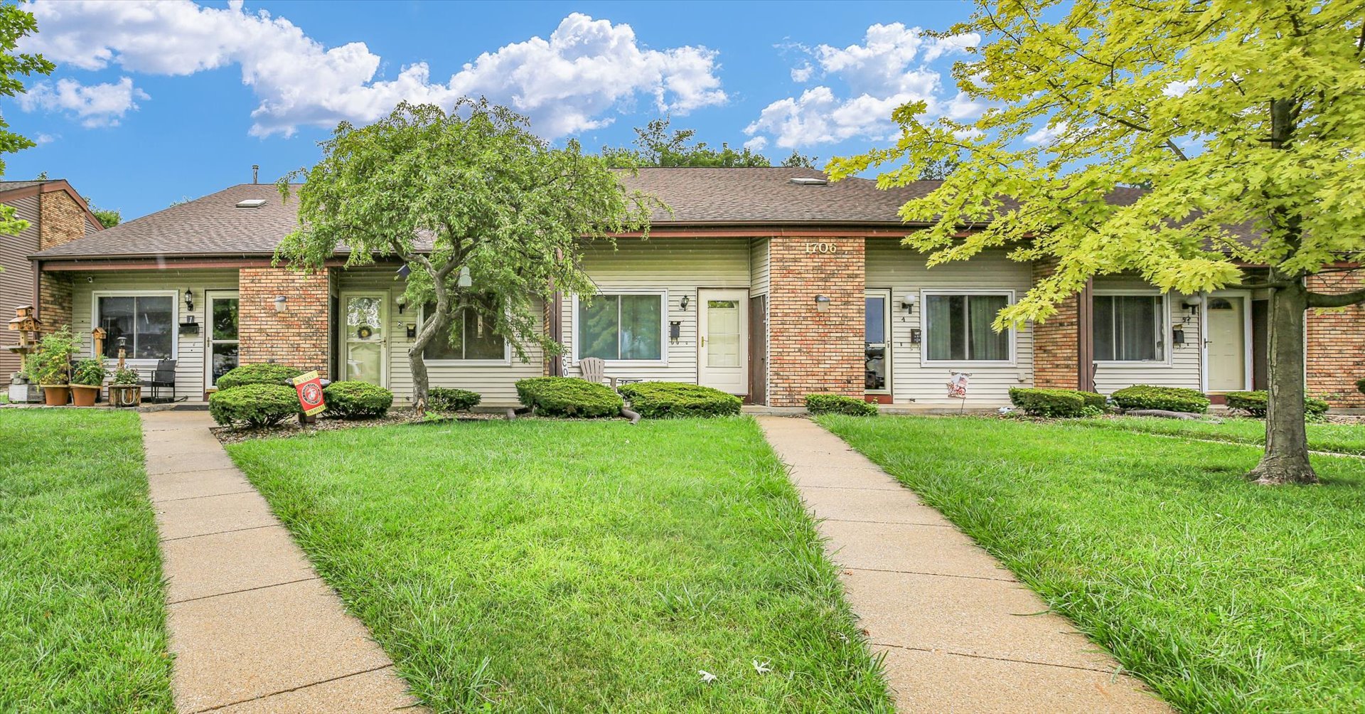 1706 Rockingham Drive, Unit 2 Normal, IL 61761 - Photo 2 of 36 a front view of a house with garden