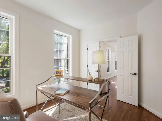 a workspace with furniture and window