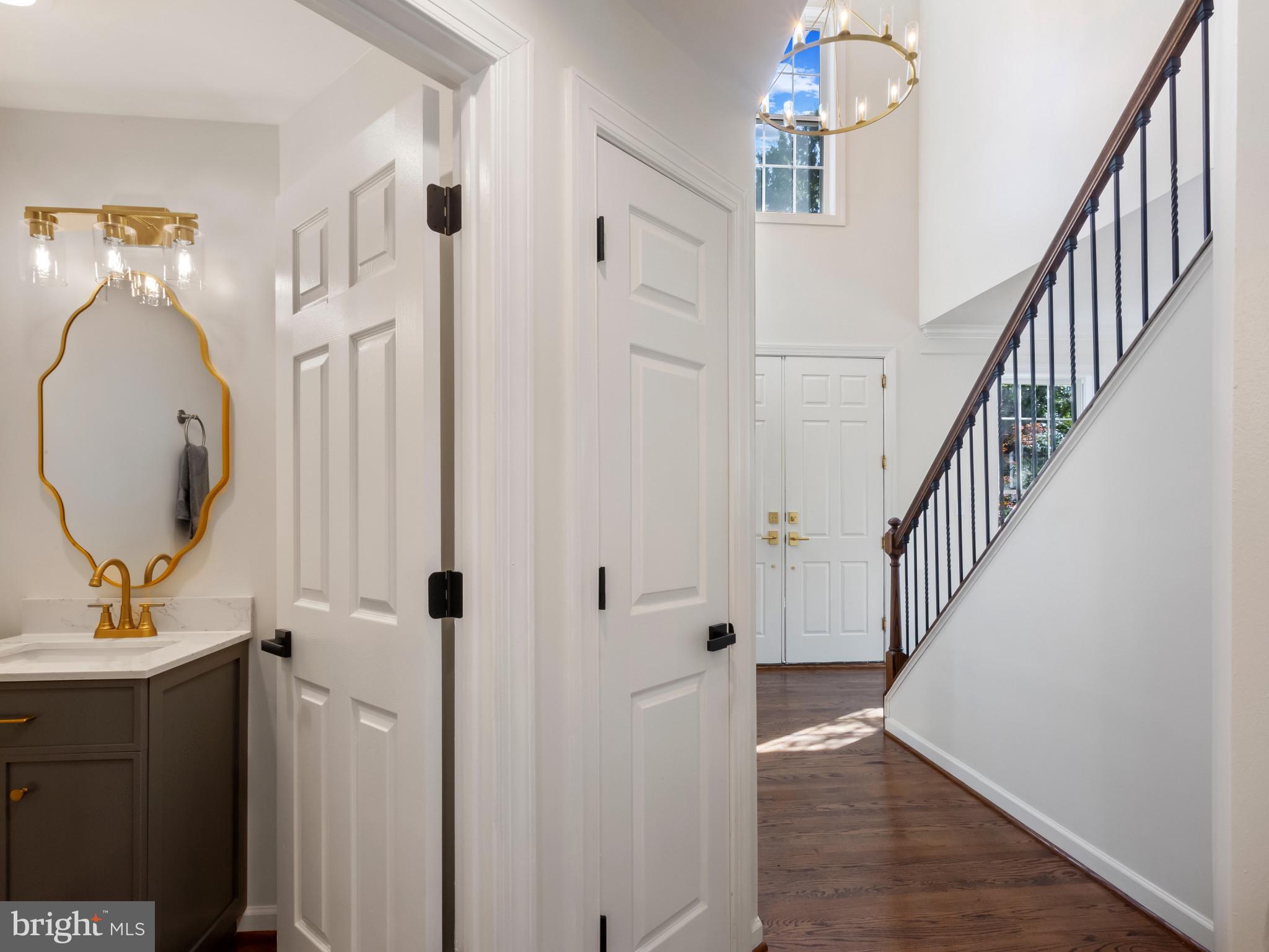 1612 Winesapp Drive Odenton, MD 21113 - Photo 12 of 34 a view of a hallway with wooden floor and entryway