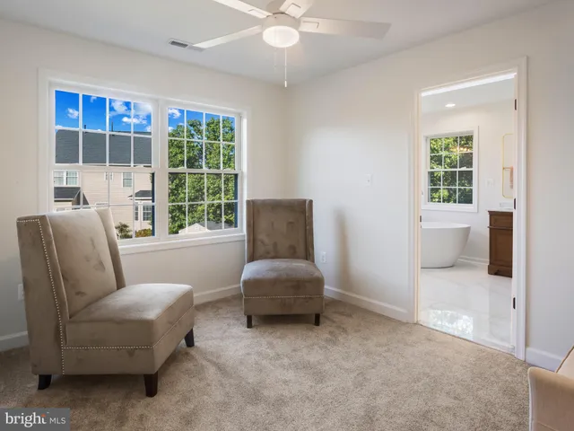 a living room with furniture and windows