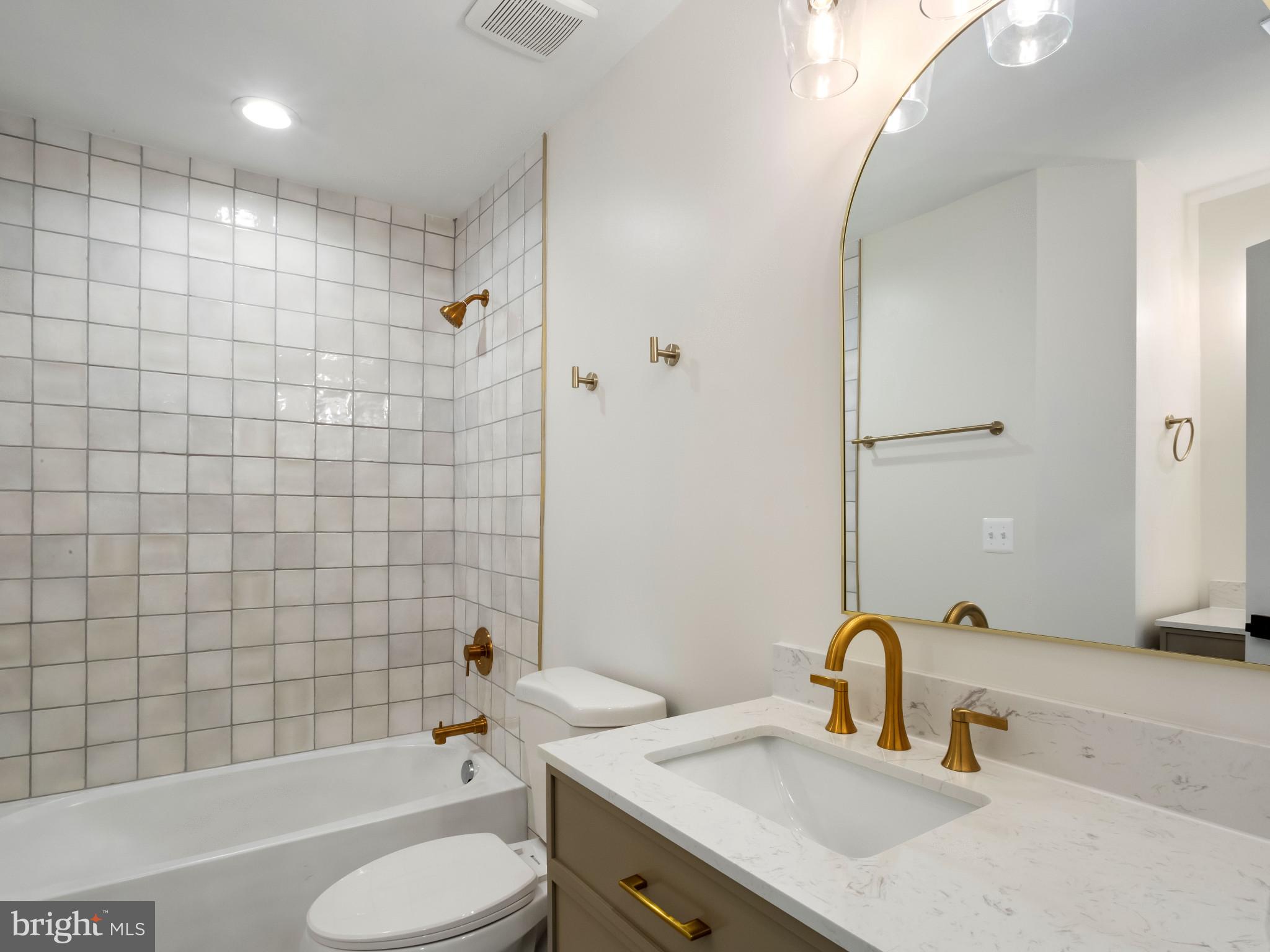 1612 Winesapp Drive Odenton, MD 21113 - Photo 21 of 34 a bathroom with a sink toilet tub and shower