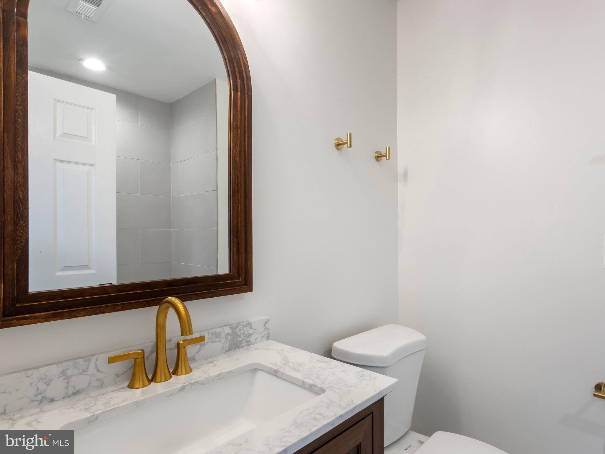 1612 Winesapp Drive Odenton, MD 21113 - Photo 25 of 34 a bathroom with a sink and a toilet