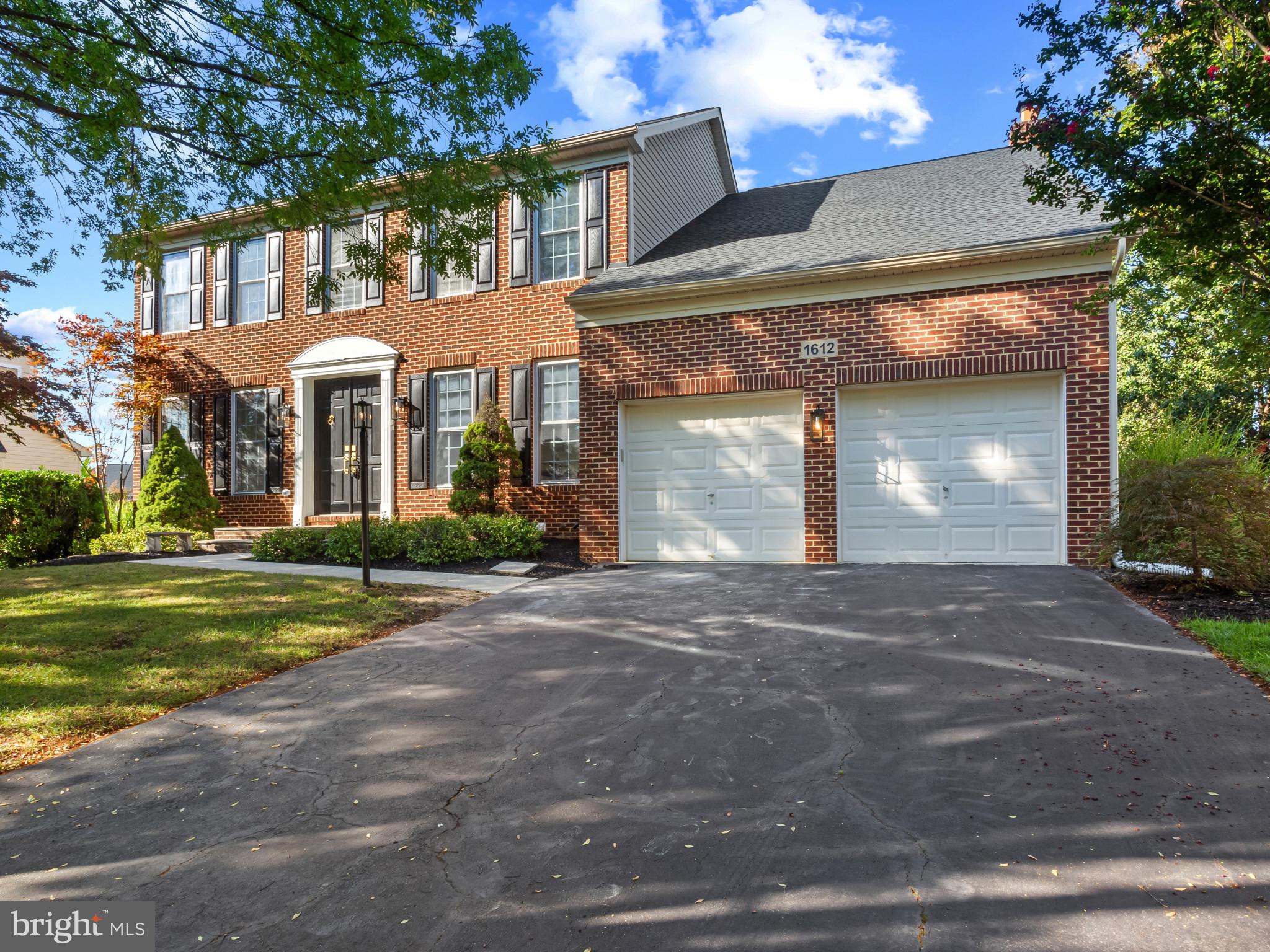 1612 Winesapp Drive Odenton, MD 21113 - Photo 33 of 34 a front view of a house with a yard and garage