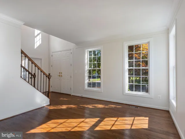 a view of an empty room with windows