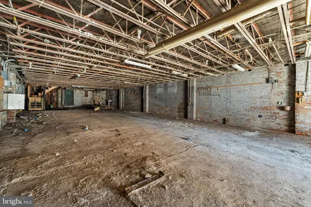 a view of a room with wooden walls