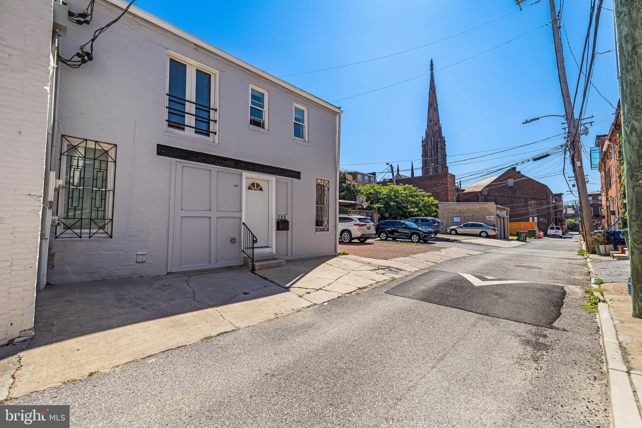 858 Tyson Street Baltimore, MD 21201 - Photo 14 of 20 a house with a bench in front of it