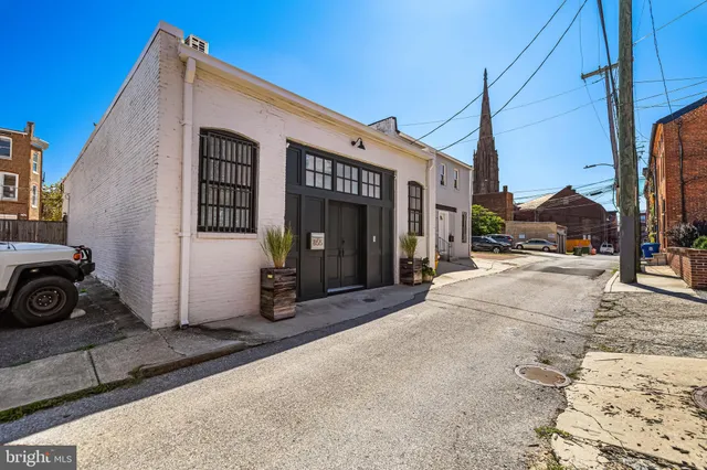 a view of a house with a street