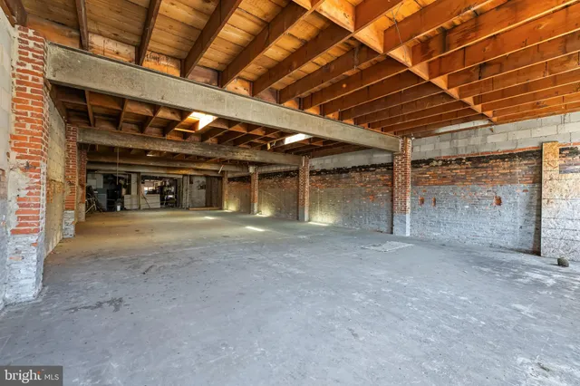 a view of an empty room with a garage