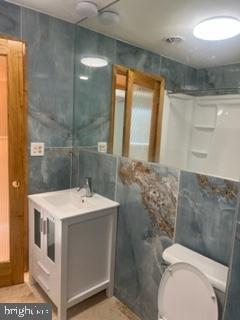 747 Garden Drive Harrisburg, PA 17111 - Photo 24 of 34 a bathroom with a sink a toilet and shower