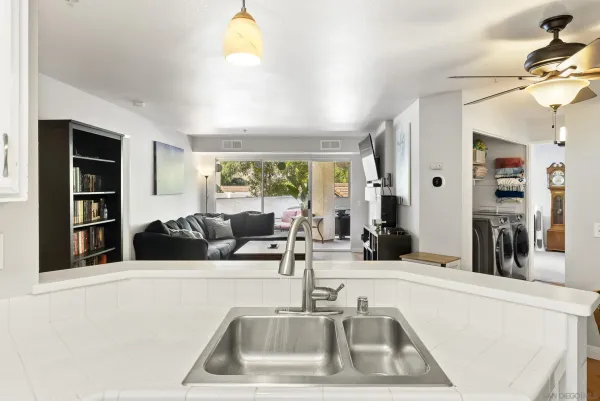 a kitchen with a sink and a window