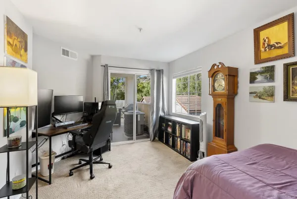 a bedroom with a workspace