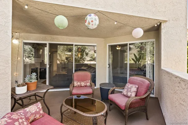a living room with furniture and outdoor space