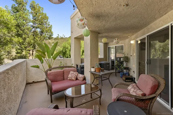 a outdoor space with patio couch and chairs
