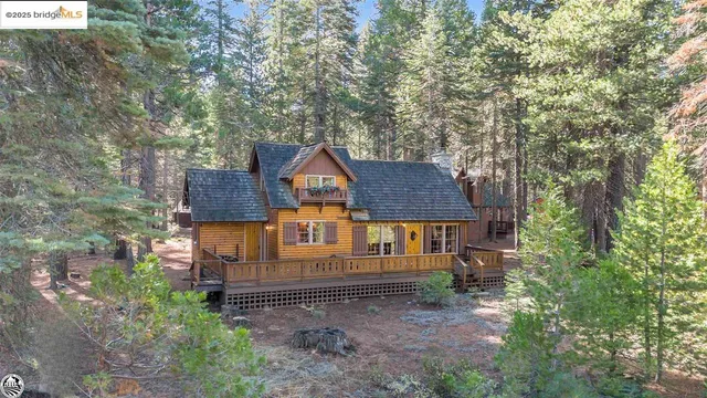 a view of a house with wooden deck