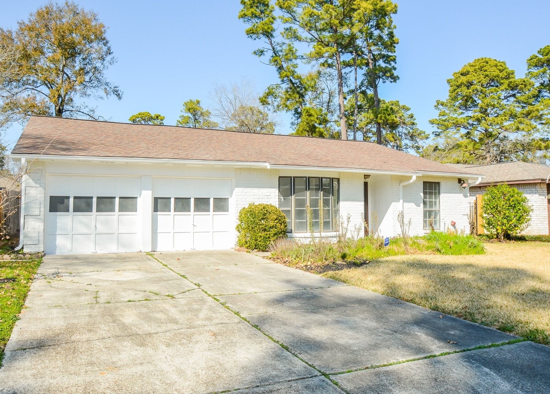 4307 Sloangate Drive Spring, TX 77373 - Photo 22 of 22 a front view of a house with a yard and potted plants