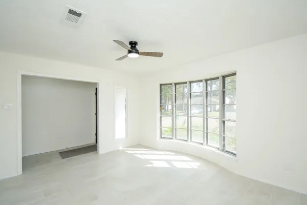 a view of an empty room with a window