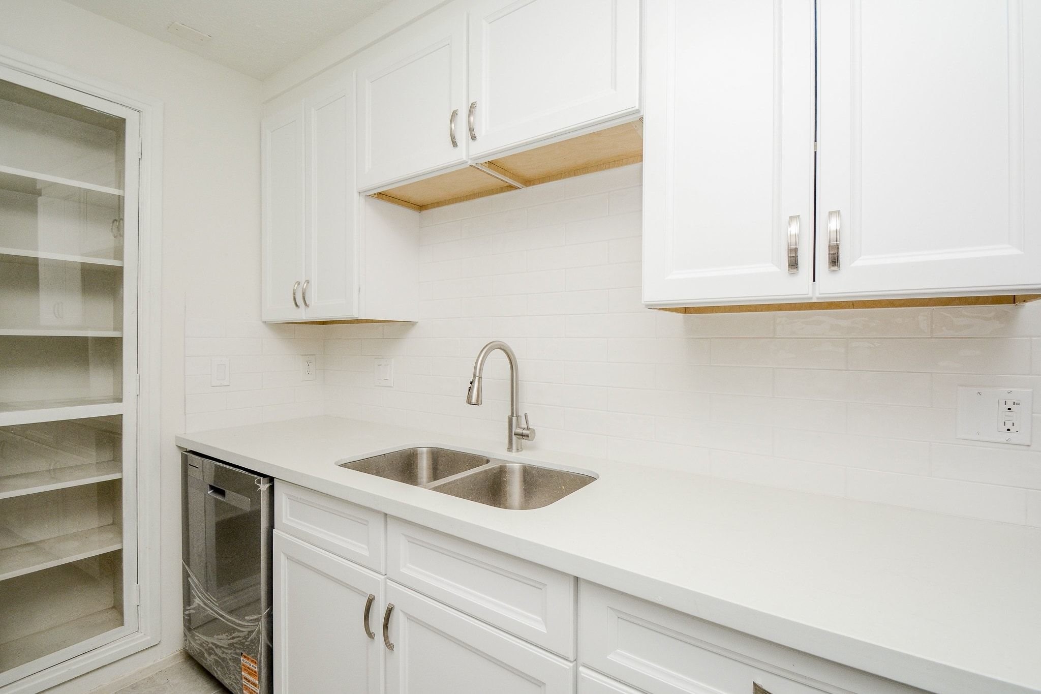 4307 Sloangate Drive Spring, TX 77373 - Photo 7 of 22 a kitchen with a sink and cabinets