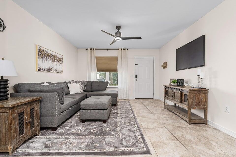 102 Lear Court Crestview, FL 32539 - Photo 13 of 37 a living room with furniture and a flat screen tv