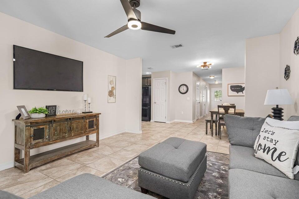 102 Lear Court Crestview, FL 32539 - Photo 15 of 37 a living room with furniture and a flat screen tv