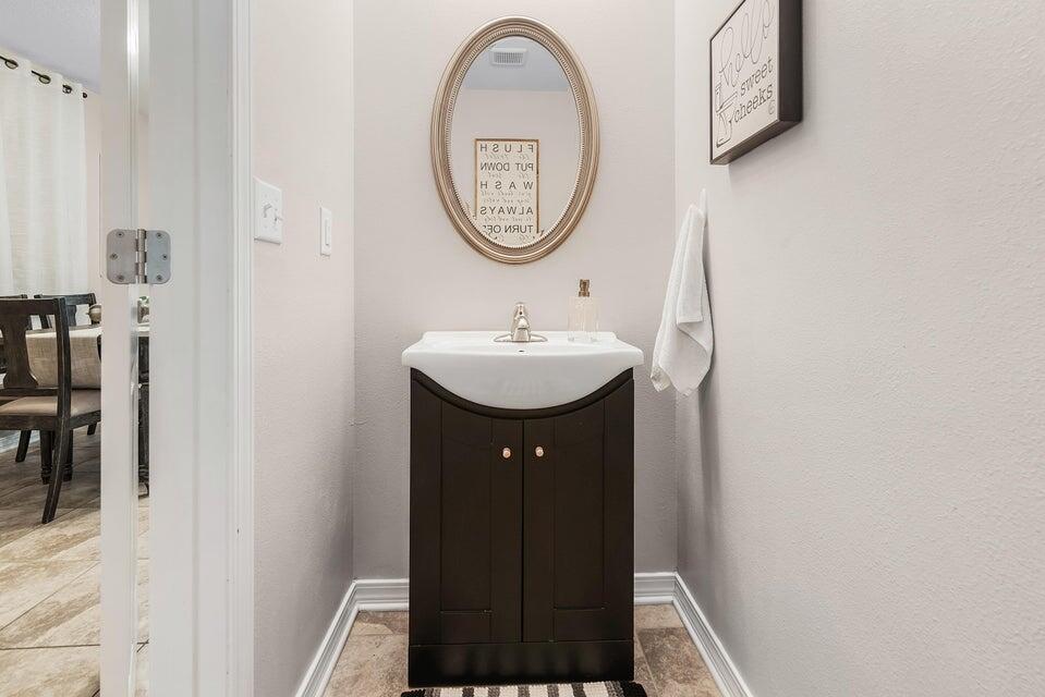 102 Lear Court Crestview, FL 32539 - Photo 16 of 37 a bathroom with a sink and a mirror