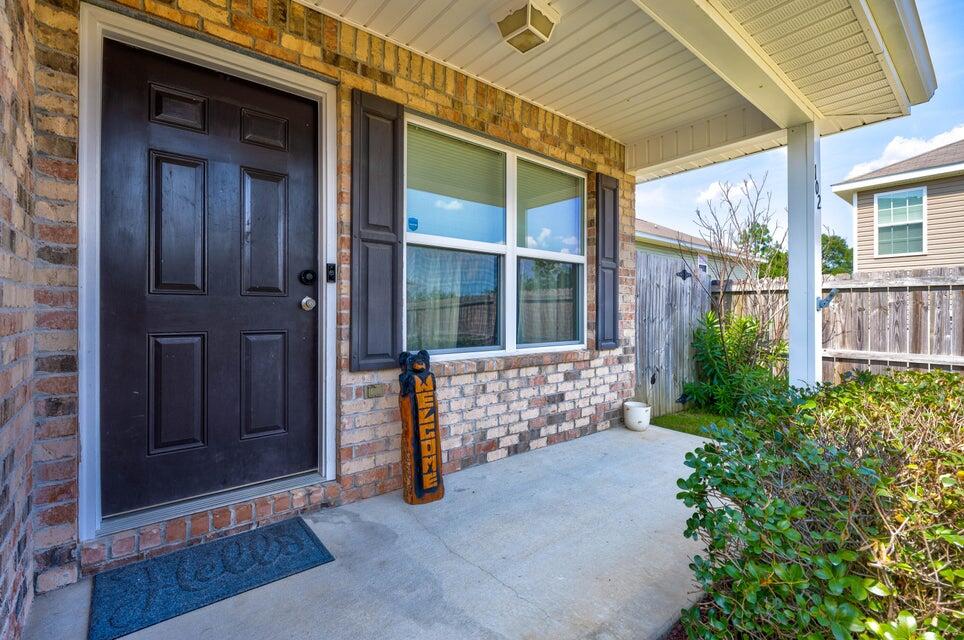 102 Lear Court Crestview, FL 32539 - Photo 2 of 37 a view of front door and small yard