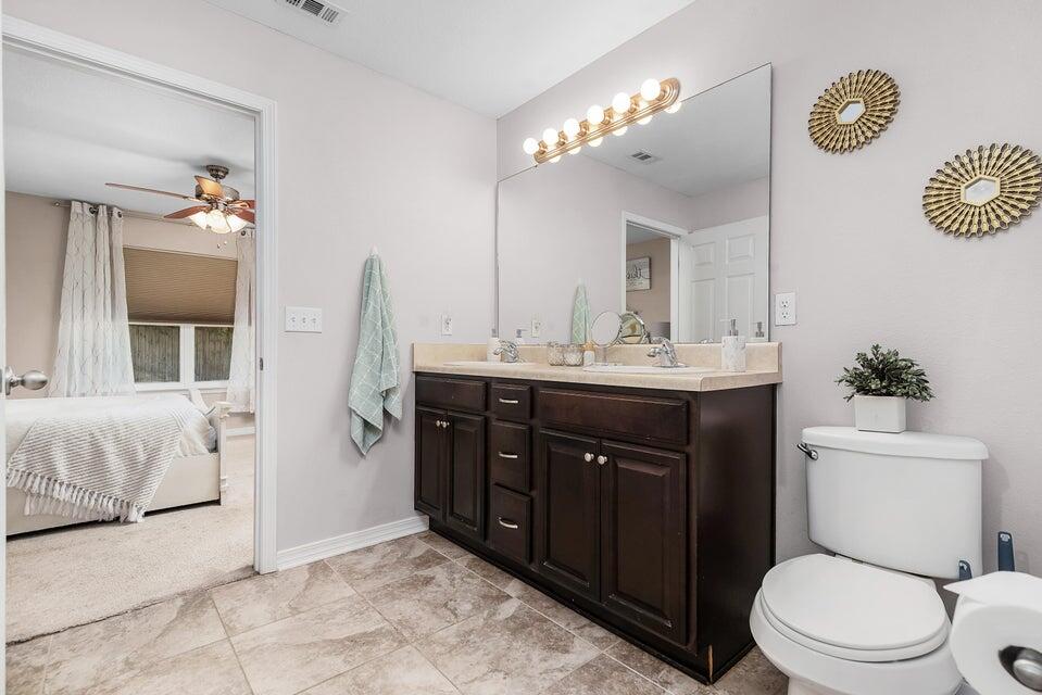 102 Lear Court Crestview, FL 32539 - Photo 23 of 37 a bathroom with a sink vanity granite and toilet