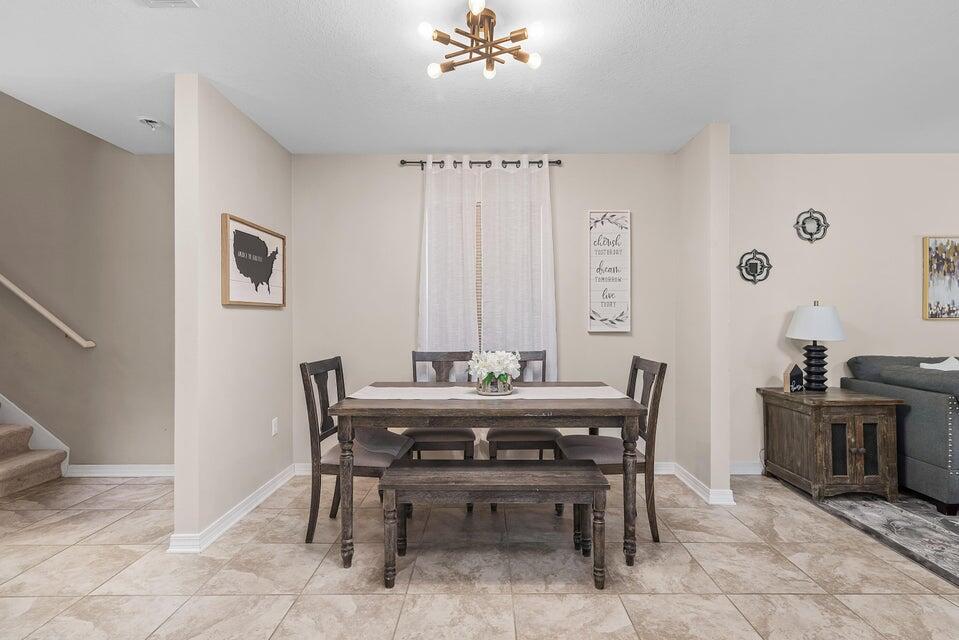 102 Lear Court Crestview, FL 32539 - Photo 10 of 37 a view of a dining room with furniture