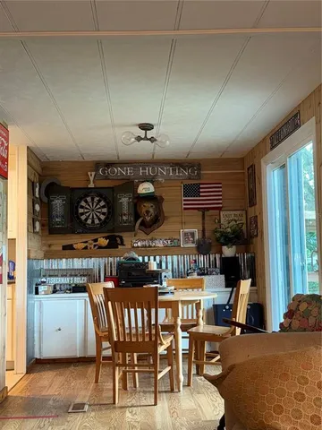 a kitchen with stainless steel appliances kitchen island granite countertop a sink and cabinets