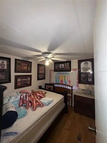 a bedroom with a bed and furniture