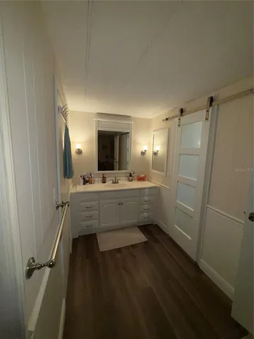 a bathroom with a sink and mirror