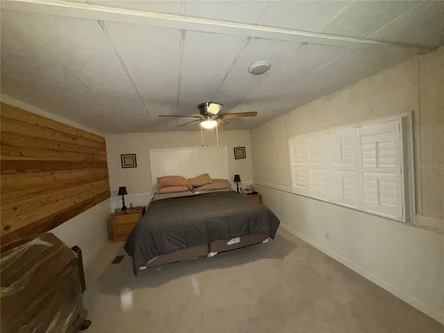 a room with a bed and a chandelier