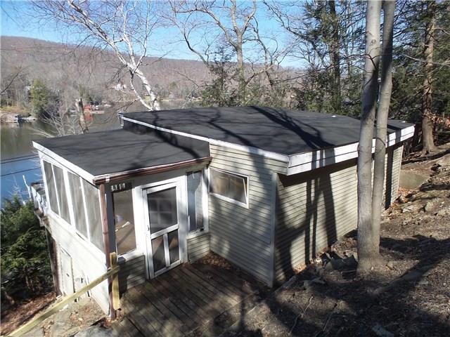 11 June Road New Preston Marble Dale, CT 06777 - Photo 1 of 1 a backyard of a house with table and chairs