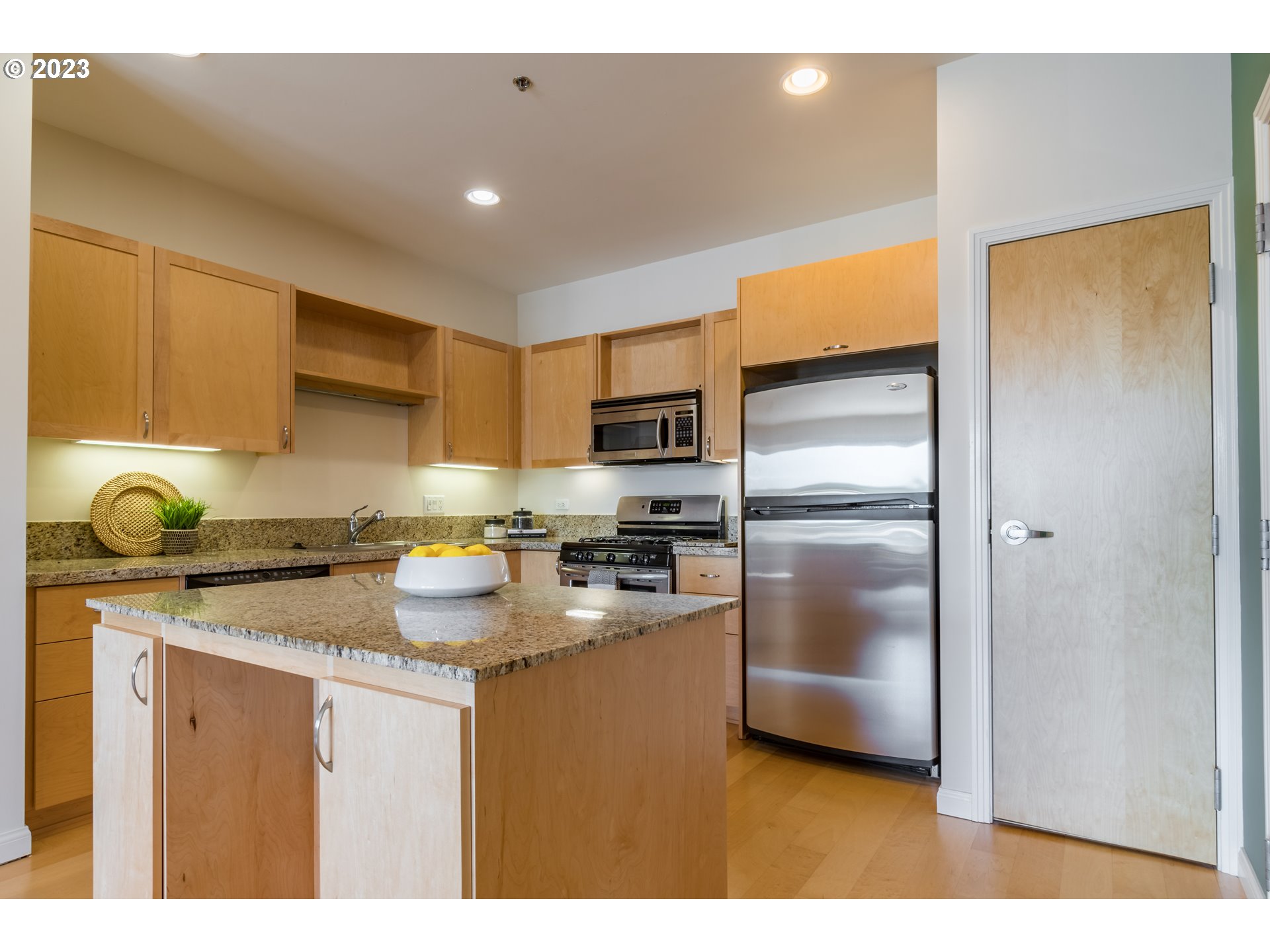 1375 Olive Street, Unit 308 Eugene, OR 97401 - Photo 12 of 35 a kitchen with a refrigerator and a sink