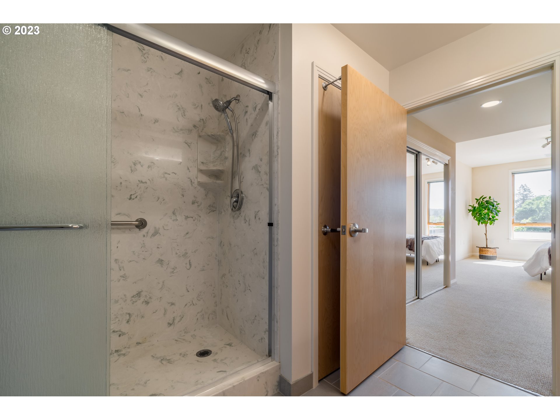 1375 Olive Street, Unit 308 Eugene, OR 97401 - Photo 22 of 35 a bathroom with a shower and a tub