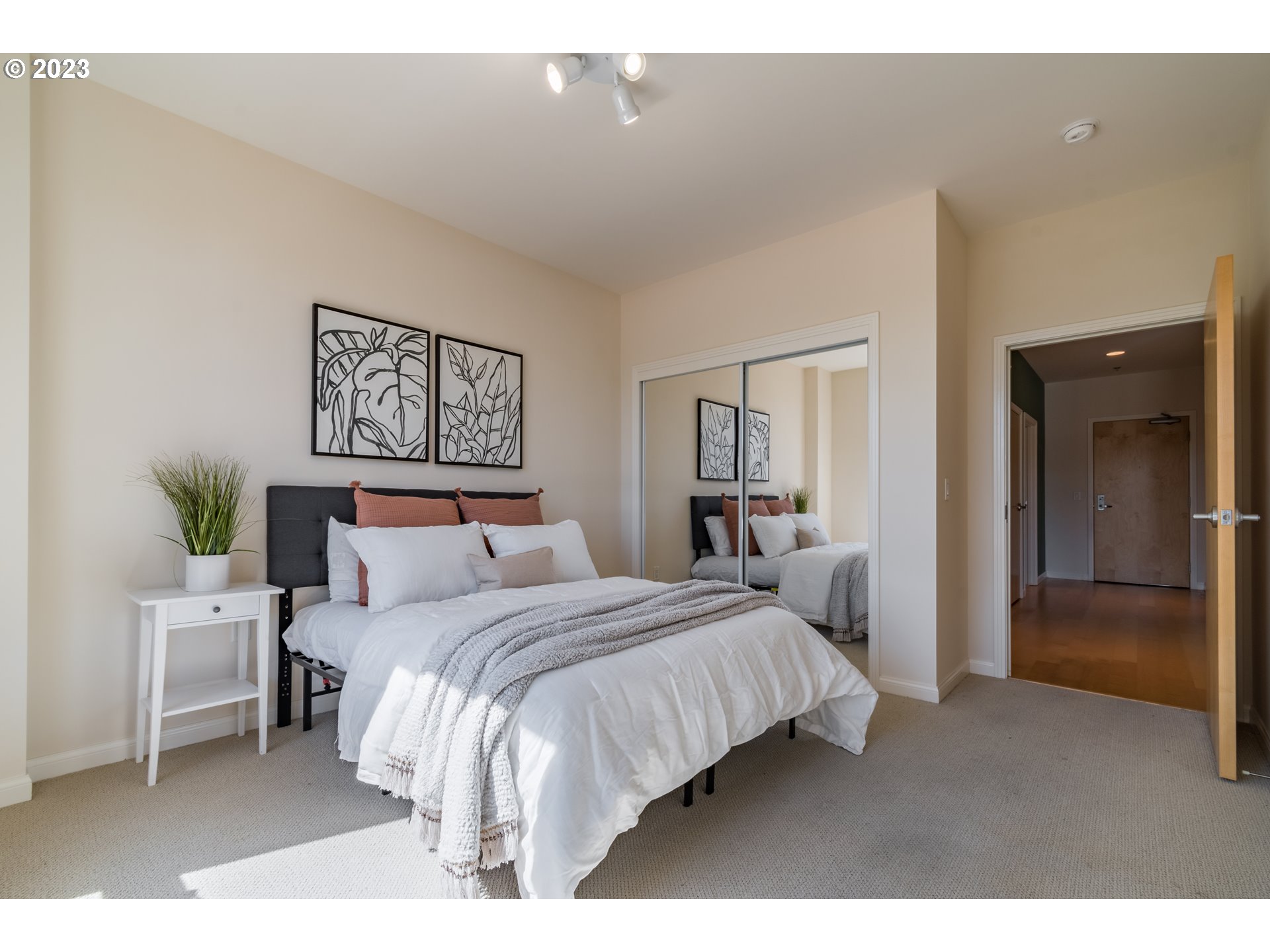 1375 Olive Street, Unit 308 Eugene, OR 97401 - Photo 25 of 35 a bedroom with a bed and a lamp