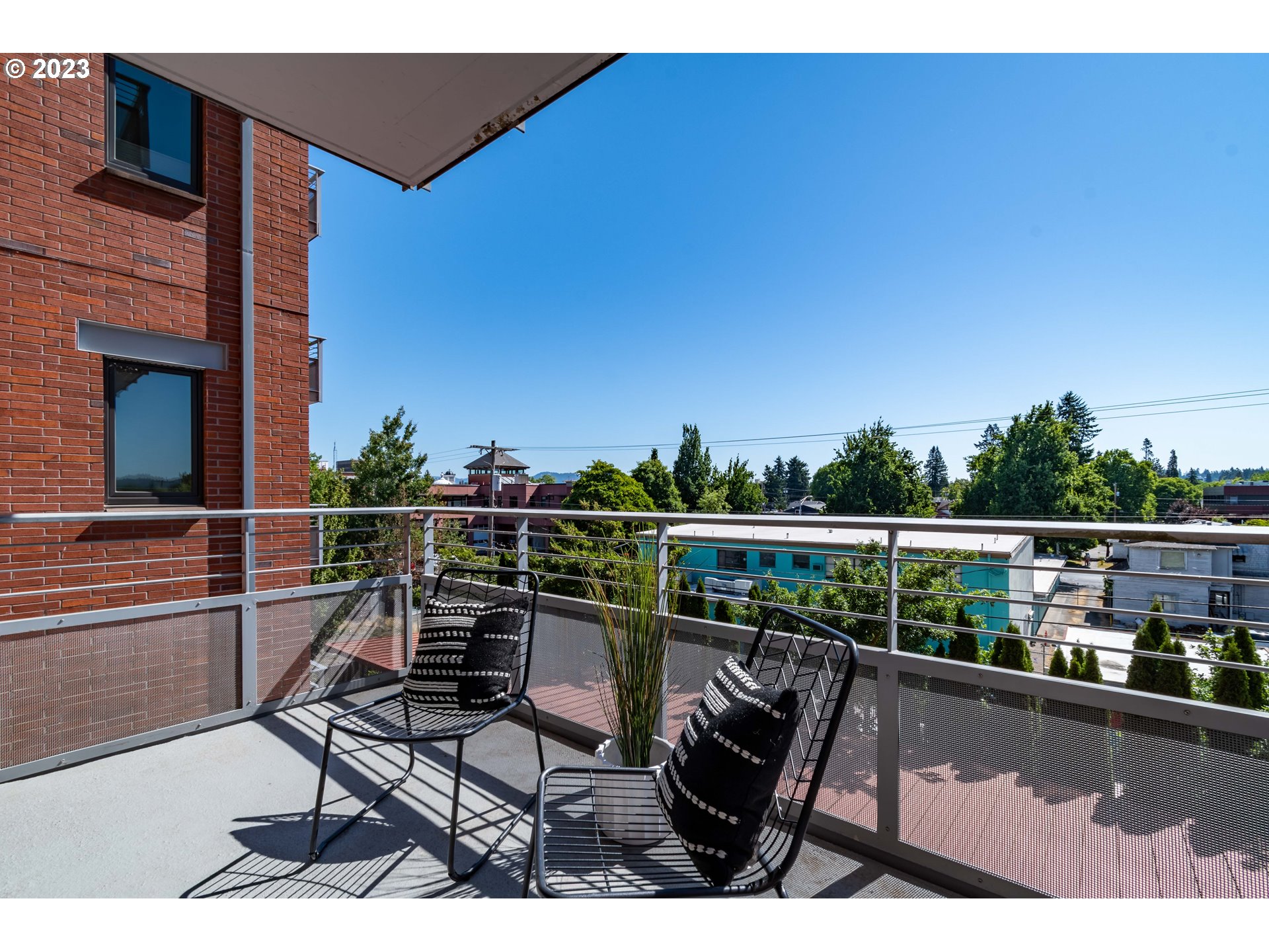1375 Olive Street, Unit 308 Eugene, OR 97401 - Photo 29 of 35 a view of a chairs and table in the balcony