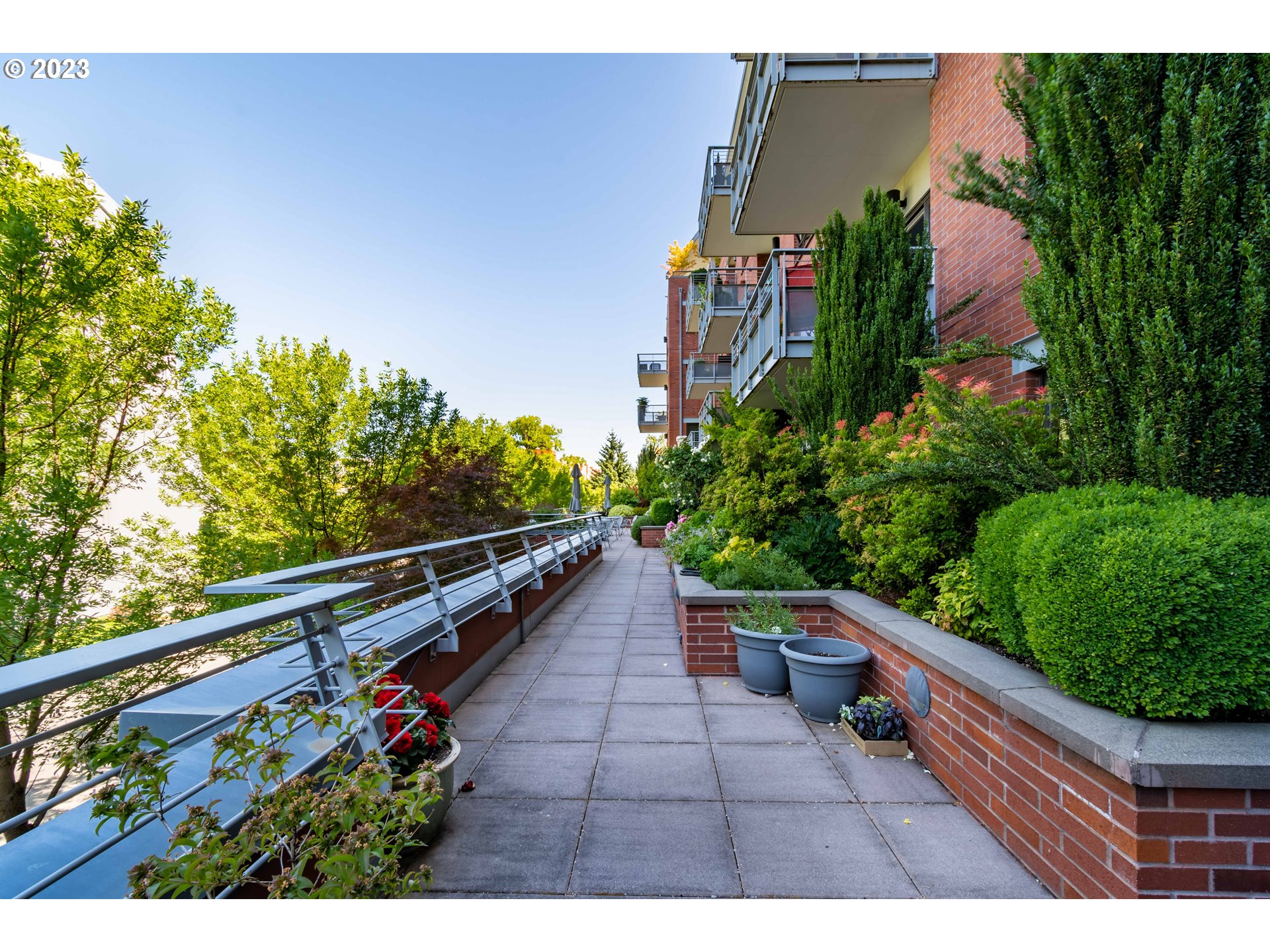 1375 Olive Street, Unit 308 Eugene, OR 97401 - Photo 33 of 35 a view of a yard with potted plants