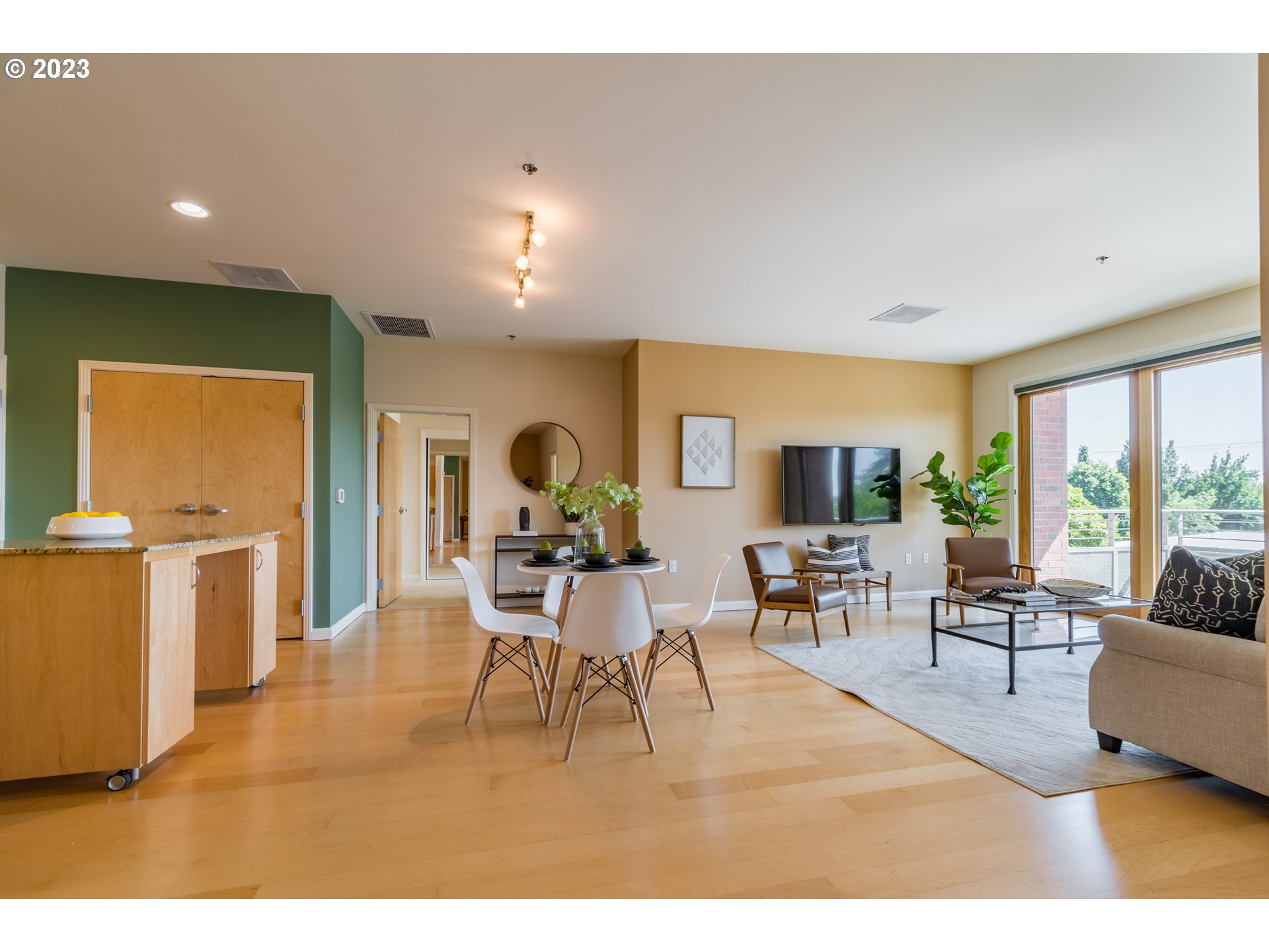 1375 Olive Street, Unit 308 Eugene, OR 97401 - Photo 9 of 35 a living room with furniture a window and kitchen view