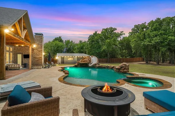 a outdoor living space with furniture and a garden