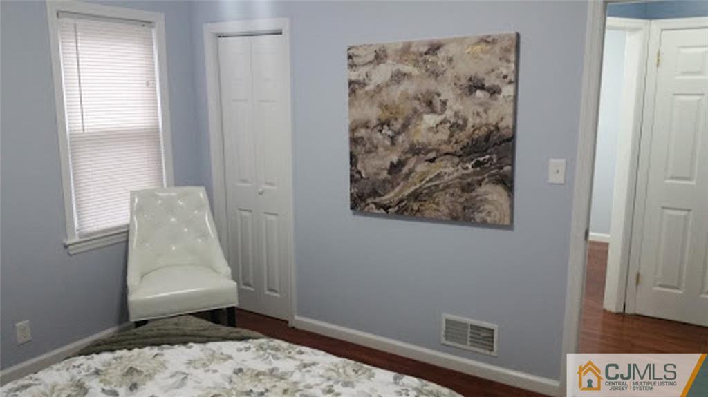 111 Old Post Road Edison, NJ 08817 - Photo 4 of 19 a view of small space with wooden floor and a window