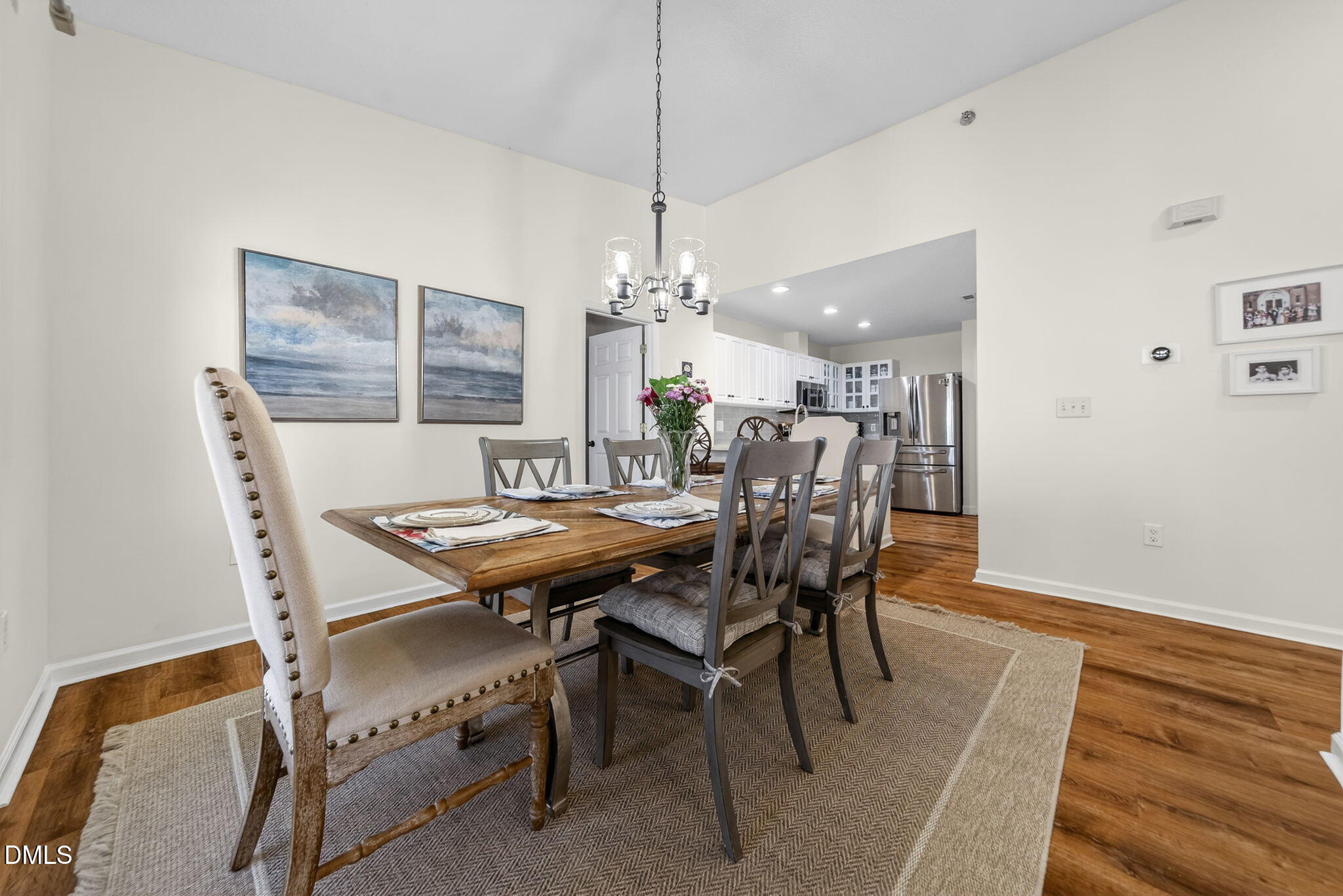 1911 Falls Landing Drive, Unit 203 Raleigh, NC 27614 - Photo 11 of 39 a dining room with furniture and window